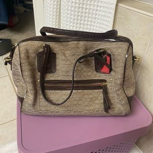 Coach handbag with shoulder strap.